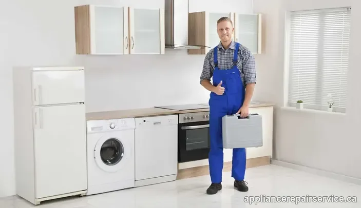 Appliance repair technician with a toolbox beside the refrigerator, washer, dishwasher and oven — in-home appliance repair in Toronto and the GTA